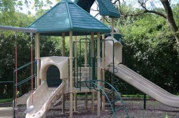 Columbus Park playground slides and climbing structure.