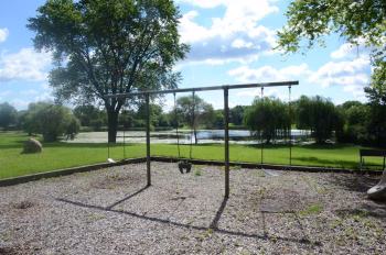 Columbus Park playground swingset, with amenities for multiple age ranges