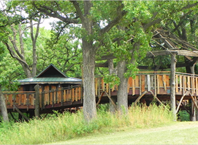 Pepper Family Treehouse is an elevated wooden structure at Citizens Park. Logs and slats of wood form the bulk of the construction, give it a rustic look and feel